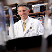 Scot C. Remick, MD, Director of the Mary Babb Randolph Cancer Center, photographed in a lab at the Mary Babb Randolph Cancer Center for the West Virginia Higher Education Policy Commission (WVHEPC) division of Science and Research.  Laboratory Photography by Alex Wilson.